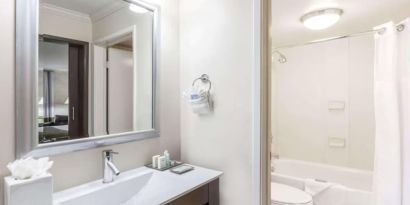 Guest bathroom with shower at Uptown Oasis San Jose Airport.