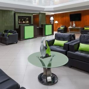 Lounge and coworking space at Uptown Oasis San Jose Airport.