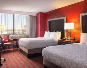 Two queen beds at Laguardia Plaza Hotel.