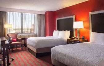 Two queen beds at Laguardia Plaza Hotel.