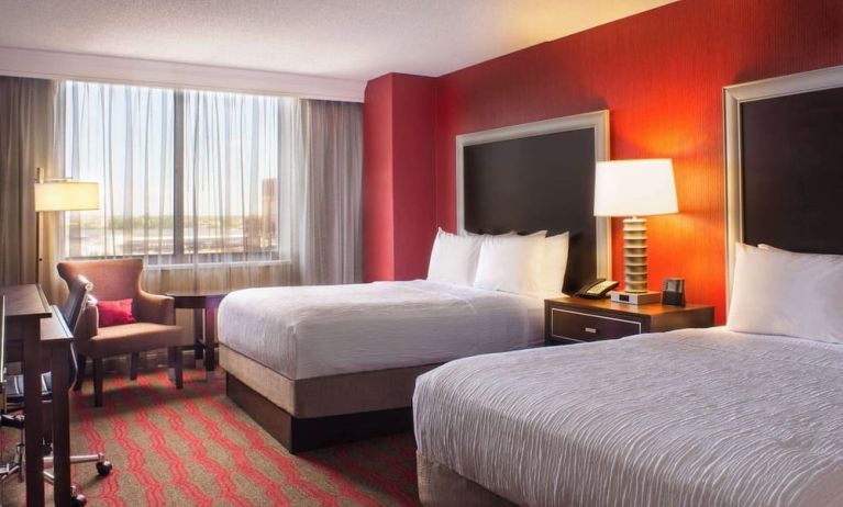 Two queen beds at Laguardia Plaza Hotel.