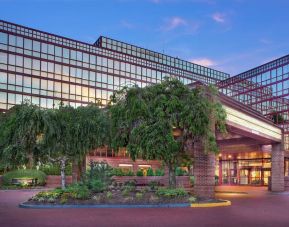 Hotel exterior and parking at Laguardia Plaza Hotel.