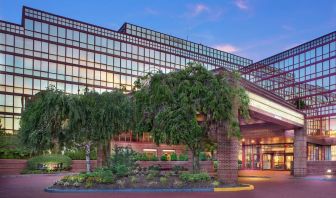 Hotel exterior and parking at Laguardia Plaza Hotel.