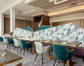 Dining room with natural light at Hilton Aberdeen TECA.