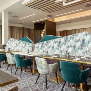 Dining room with natural light at Hilton Aberdeen TECA.