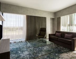 Presidential suite with lounge area at Hilton Aberdeen TECA.