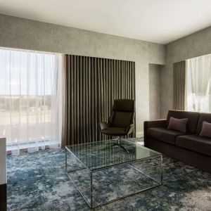 Presidential suite with lounge area at Hilton Aberdeen TECA.