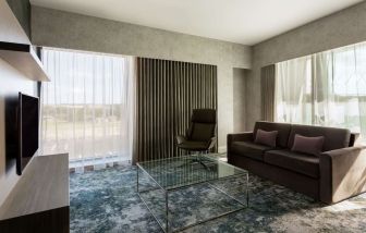 Presidential suite with lounge area at Hilton Aberdeen TECA.