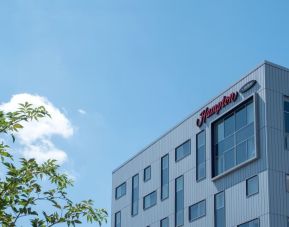 Hotel exterior by day at Hampton By Hilton London Gatwick Airport.