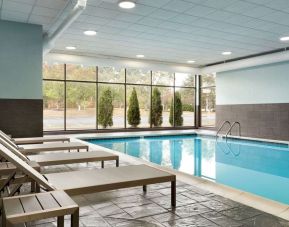 Indoor pool with loungers at Radisson Hotel Akron/Fairlawn.