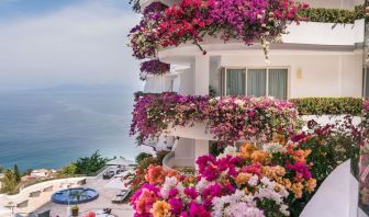 Luxury hotel with flowers at Grand Miramar All Luxury Suites & Residences.