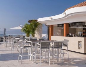 Hotel bar and terrace at Grand Miramar All Luxury Suites & Residences.