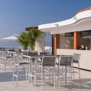 Hotel bar and terrace at Grand Miramar All Luxury Suites & Residences.