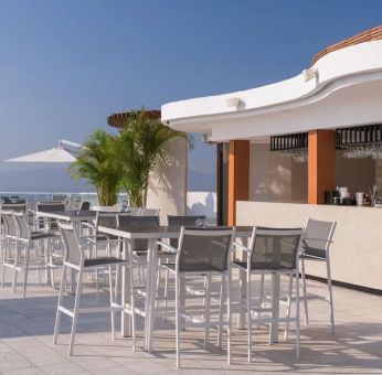 Hotel bar and terrace at Grand Miramar All Luxury Suites & Residences.