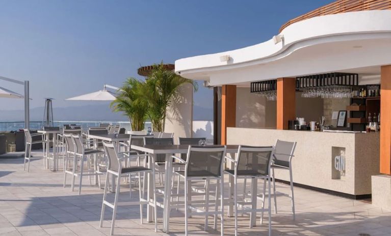 Hotel bar and terrace at Grand Miramar All Luxury Suites & Residences.