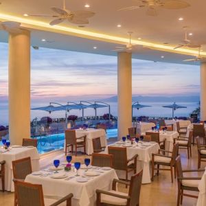 Dining room with sea view at Grand Miramar All Luxury Suites & Residences.