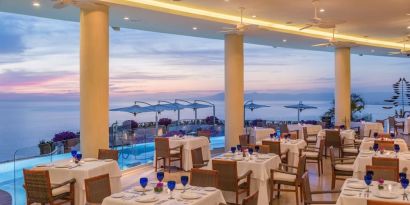 Dining room with sea view at Grand Miramar All Luxury Suites & Residences.