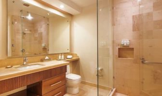 Guest bathroom with shower at Grand Miramar All Luxury Suites & Residences.