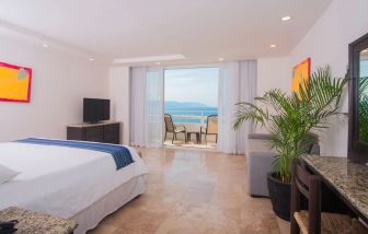 Romantic king room with sea view at Hotel Delfin PV Beach Resort.