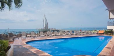 Luxurious outdoor pool at Hotel Delfin PV Beach Resort.