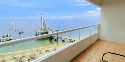 Day use room with outdoor terrace at Hotel Delfin PV Beach Resort.