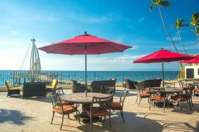 Outdoor terrace and seating area at Hotel Delfin PV Beach Resort.