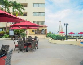 Outdoor seating and coworking space at Hotel Delfin PV Beach Resort.