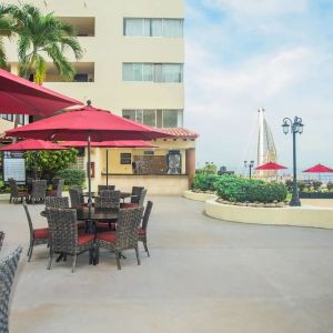 Outdoor seating and coworking space at Hotel Delfin PV Beach Resort.