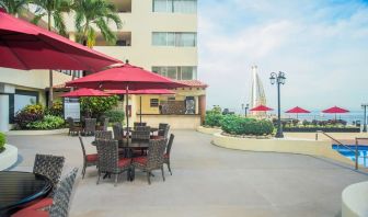 Outdoor seating and coworking space at Hotel Delfin PV Beach Resort.