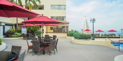 Outdoor seating and coworking space at Hotel Delfin PV Beach Resort.