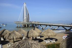 Beach access and marina at Hotel Delfin PV Beach Resort.