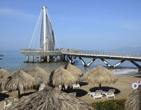 Beach access and marina at Hotel Delfin PV Beach Resort.