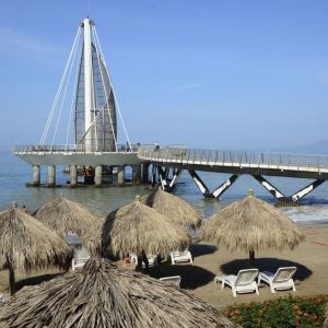 Beach access and marina at Hotel Delfin PV Beach Resort.