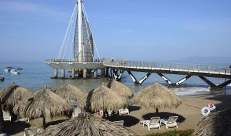 Beach access and marina at Hotel Delfin PV Beach Resort.