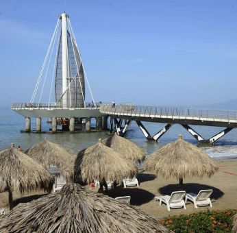 Beach access and marina at Hotel Delfin PV Beach Resort.