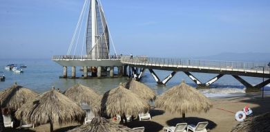 Beach access and marina at Hotel Delfin PV Beach Resort.