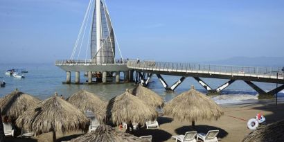 Beach access and marina at Hotel Delfin PV Beach Resort.