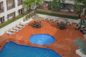 Bird's eye view of outdoor pool area at Hotel Delfin PV Beach Resort.