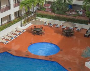 Bird's eye view of outdoor pool area at Hotel Delfin PV Beach Resort.