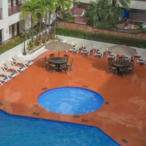 Bird's eye view of outdoor pool area at Hotel Delfin PV Beach Resort.