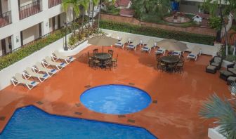 Bird's eye view of outdoor pool area at Hotel Delfin PV Beach Resort.