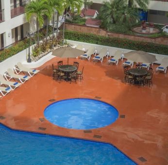 Bird's eye view of outdoor pool area at Hotel Delfin PV Beach Resort.