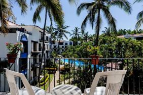 Balcony with pool view at Puerto De Luna Pet Friendly & Family Suites.