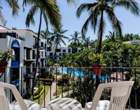 Balcony with pool view at Puerto De Luna Pet Friendly & Family Suites.