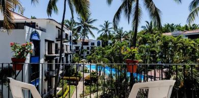 Balcony with pool view at Puerto De Luna Pet Friendly & Family Suites.