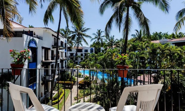 Balcony with pool view at Puerto De Luna Pet Friendly & Family Suites.