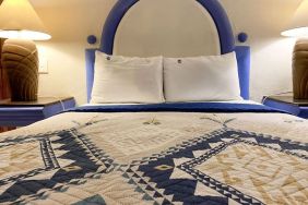 Romantic king room at Puerto De Luna Pet Friendly & Family Suites.