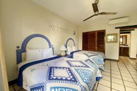 Two queen beds at Puerto De Luna Pet Friendly & Family Suites.