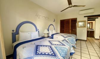 Two queen beds at Puerto De Luna Pet Friendly & Family Suites.