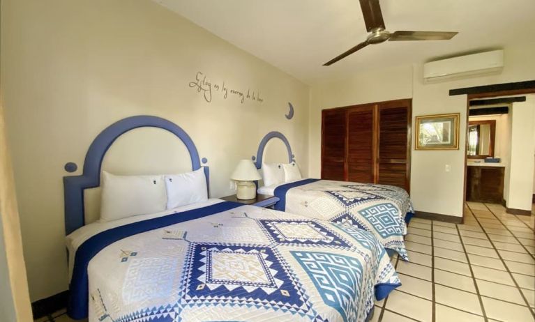 Two queen beds at Puerto De Luna Pet Friendly & Family Suites.